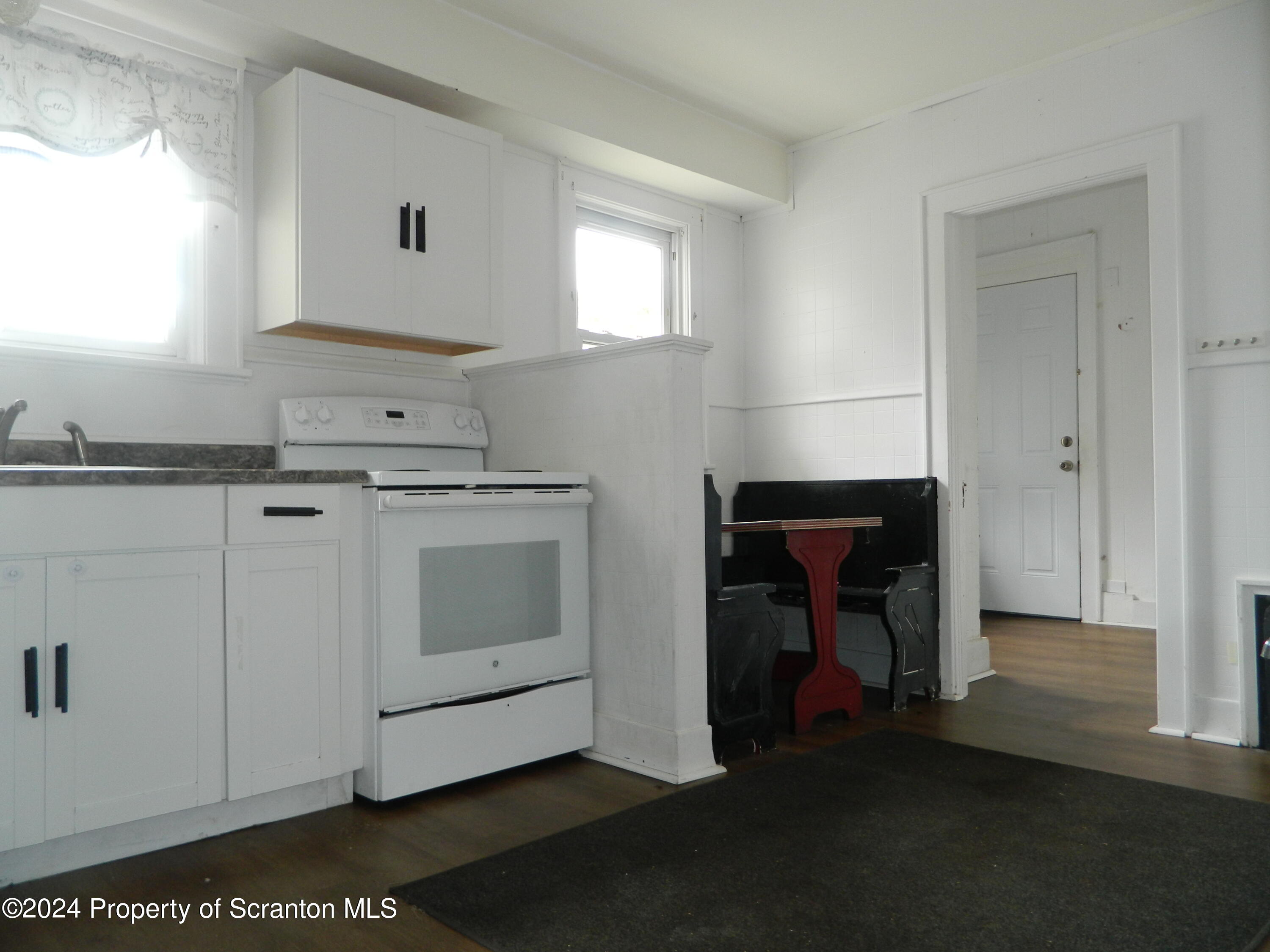 753 North Main Avenue, Unit 1 Scranton, PA 18504 - Photo 7 of 10 a kitchen with a stove and a sink