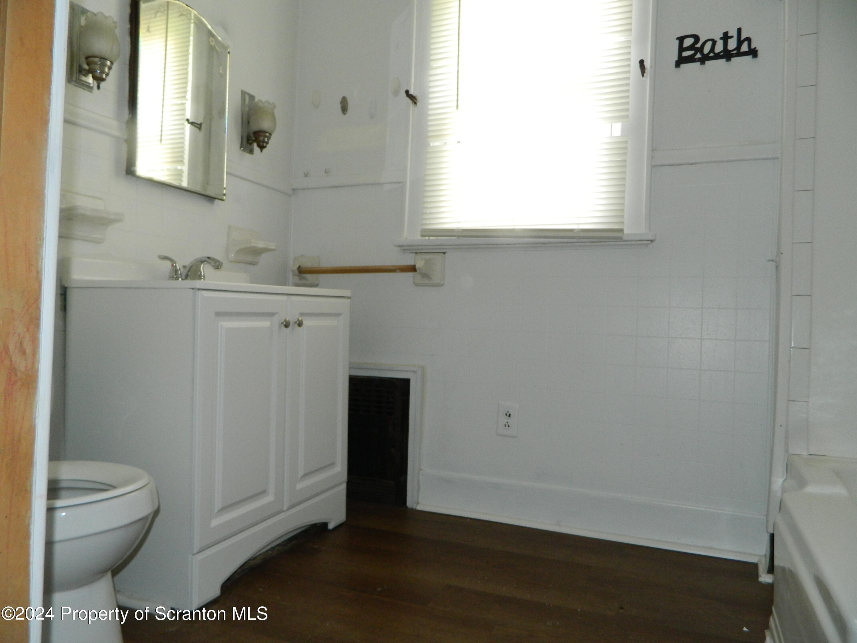753 North Main Avenue, Unit 1 Scranton, PA 18504 - Photo 10 of 10 a bathroom with a granite countertop toilet and sink