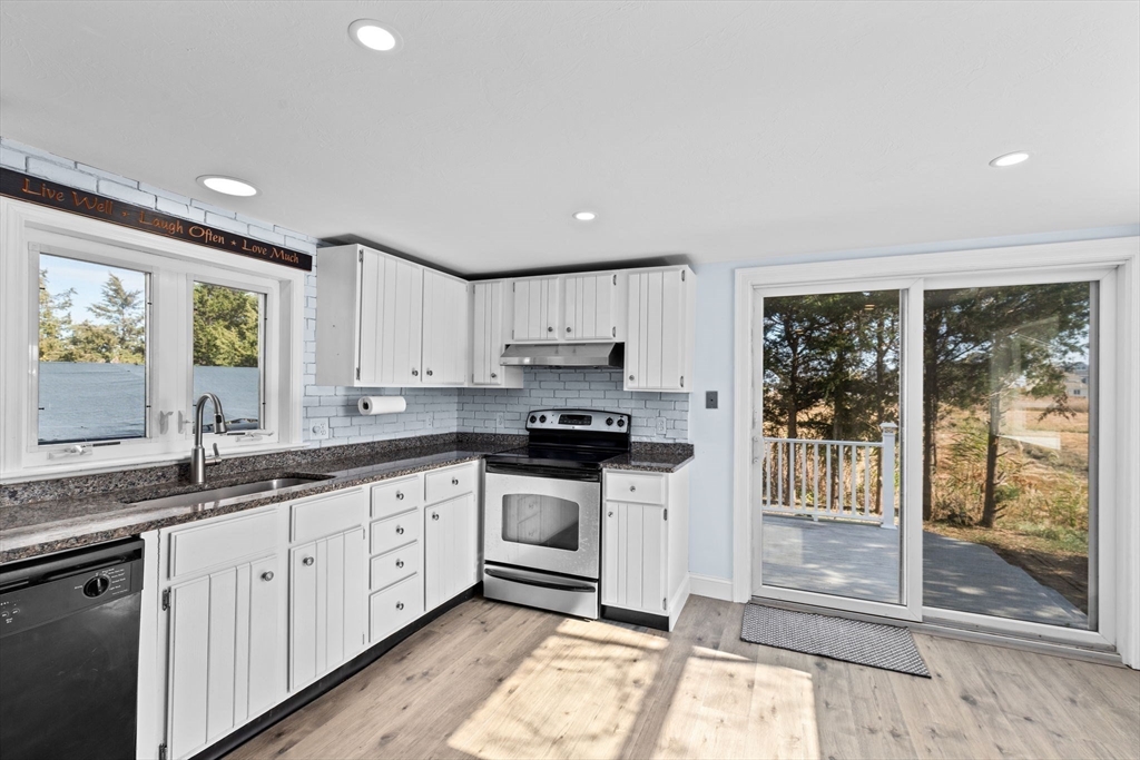 74 Cherry Street Marshfield, MA 02020 - Photo 11 of 35 a kitchen with granite countertop a sink stainless steel appliances and cabinets