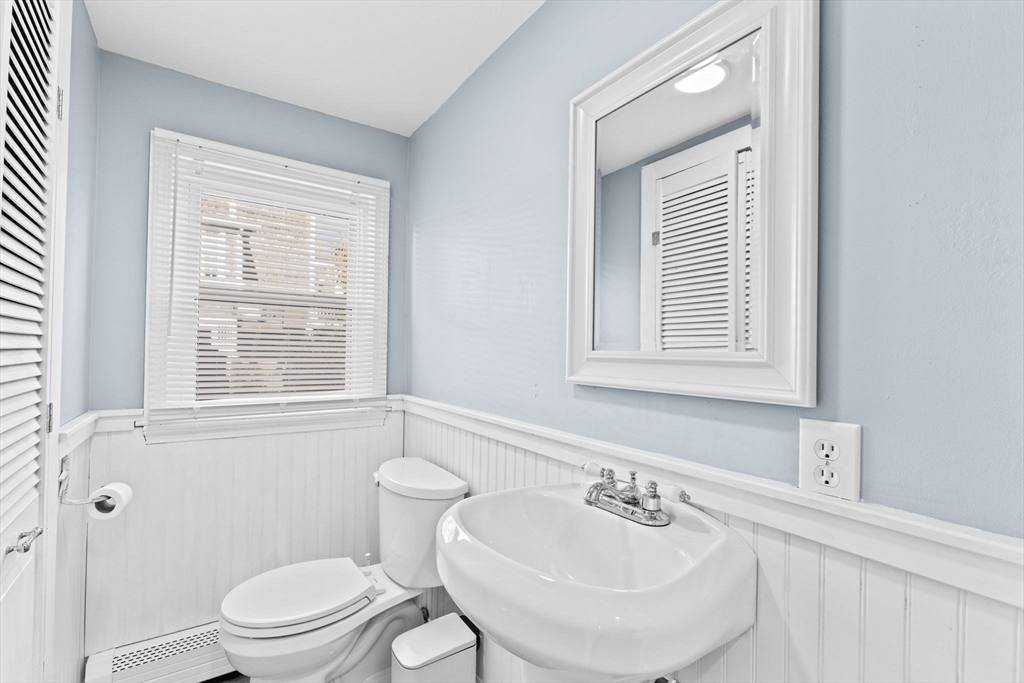 74 Cherry Street Marshfield, MA 02020 - Photo 13 of 35 a bathroom with a sink a toilet and a window