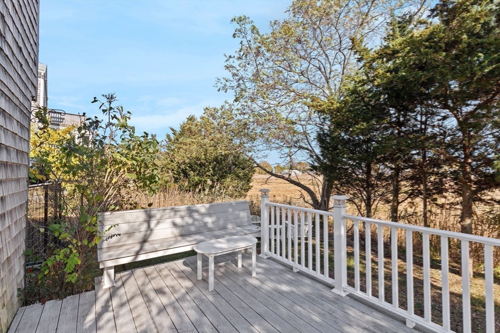 74 Cherry Street Marshfield, MA 02020 - Photo 2 of 35 a view of a chairs and table on the wooden floor