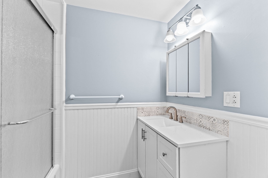 74 Cherry Street Marshfield, MA 02020 - Photo 22 of 35 a bathroom with a sink and a mirror