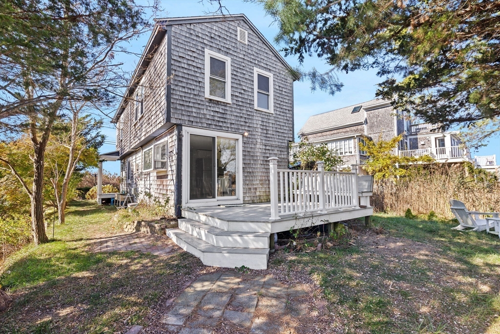 74 Cherry Street Marshfield, MA 02020 - Photo 26 of 35 a view of a house with a yard and wooden fence