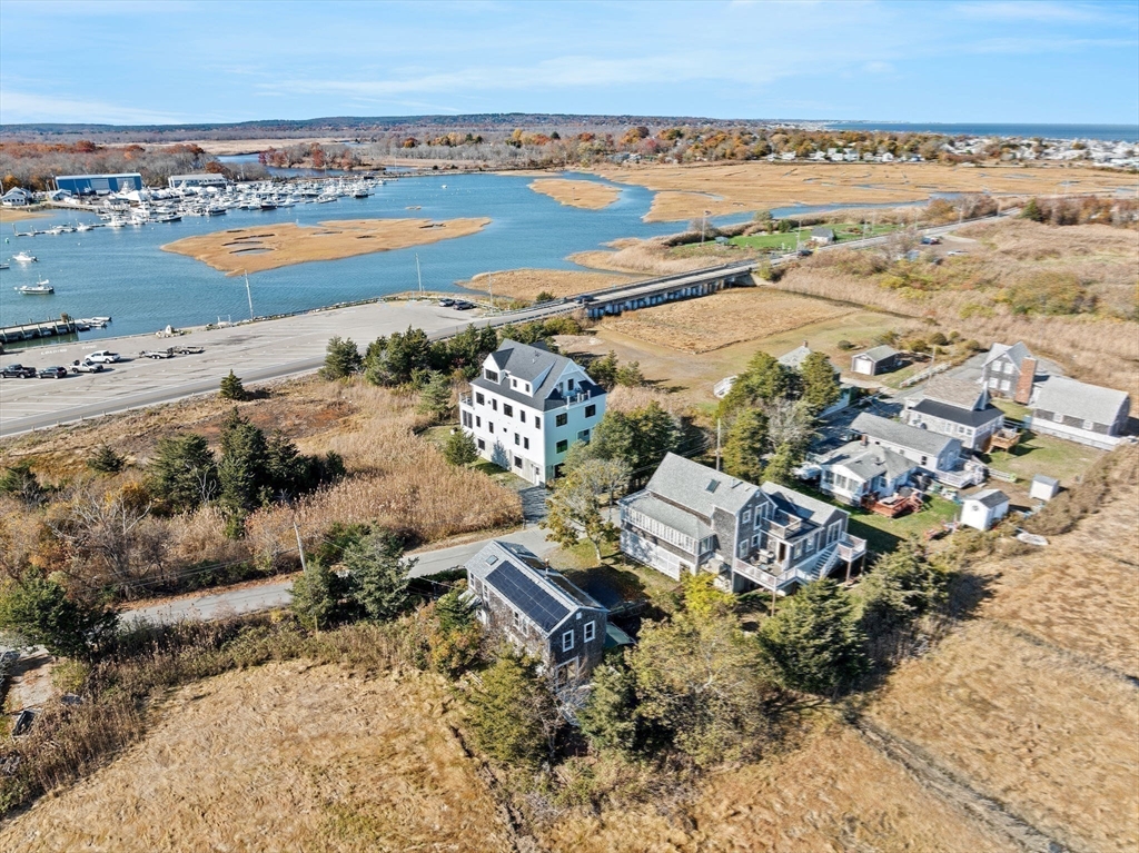 74 Cherry Street Marshfield, MA 02020 - Photo 31 of 35 an aerial view of ocean and residential houses with outdoor space