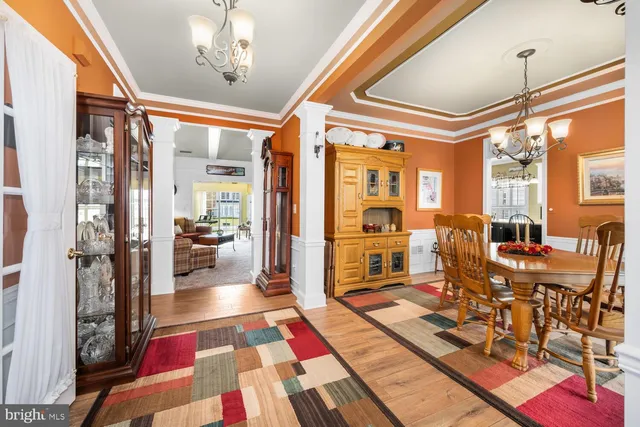 a very nice looking room with many windows and furniture