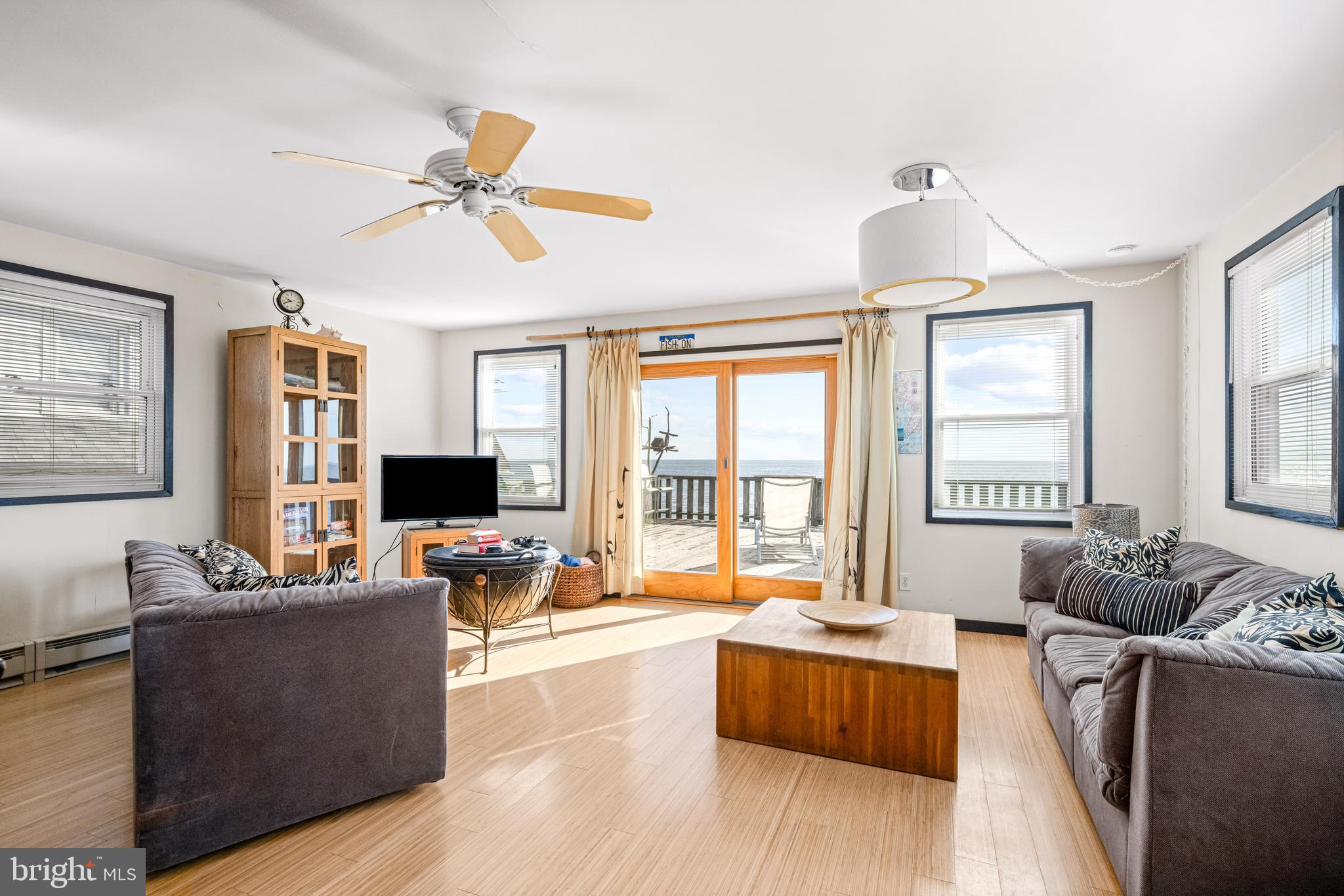 94 Delaware Avenue Fortescue, NJ 08321 - Photo 18 of 31 a living room with furniture and a flat screen tv