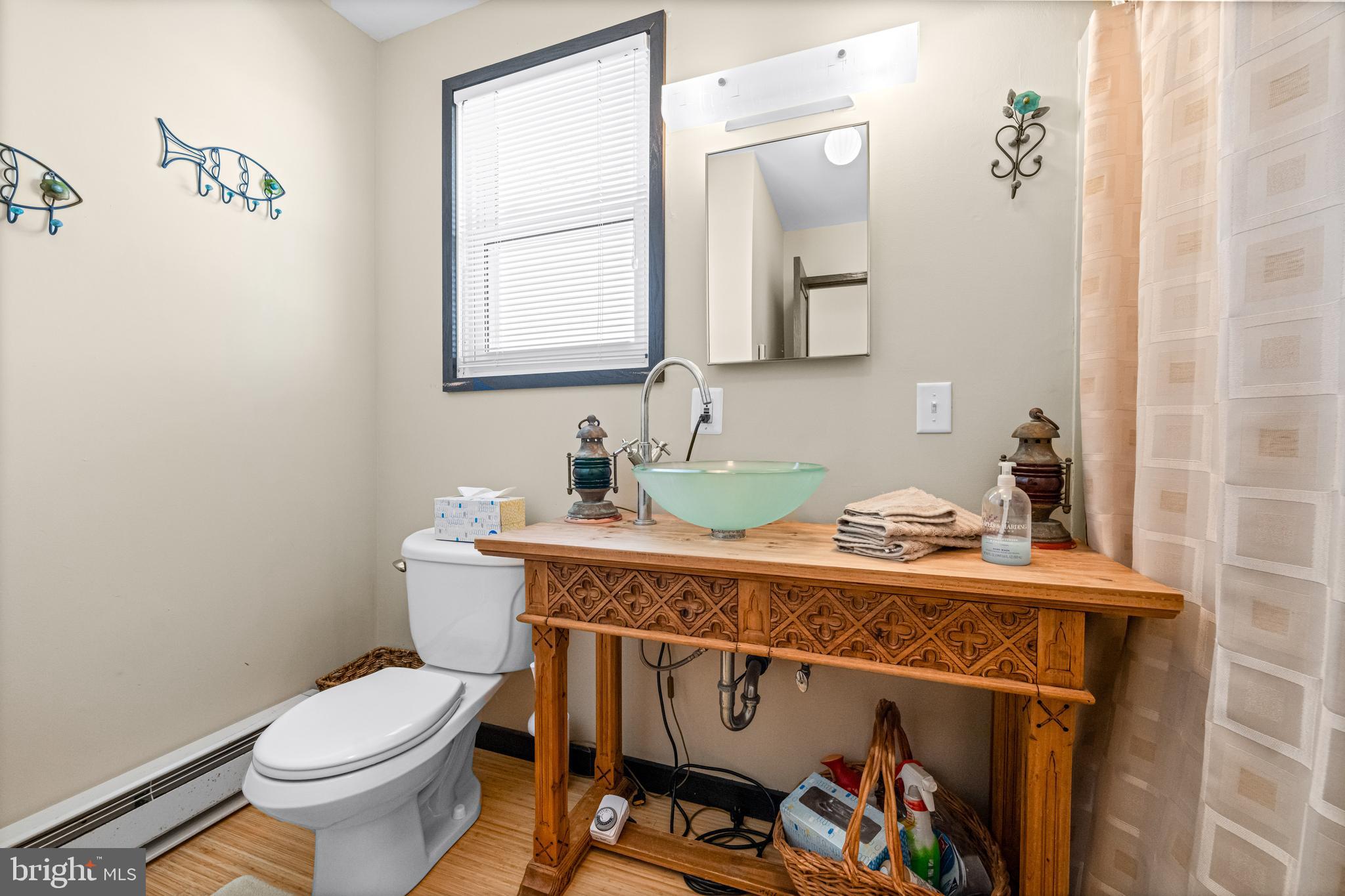 94 Delaware Avenue Fortescue, NJ 08321 - Photo 25 of 31 a bathroom with a toilet a sink and a mirror