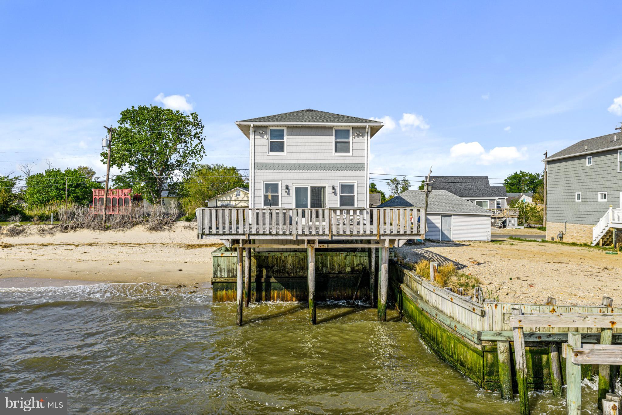 94 Delaware Avenue Fortescue, NJ 08321 - Photo 3 of 31 a view of a roof deck with chair and table
