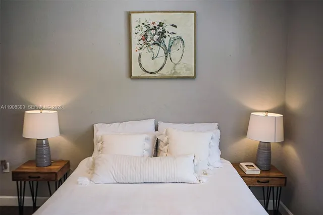 a bed room with a bed and a night stand