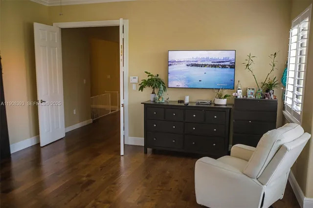 a living room with furniture a rug and a window