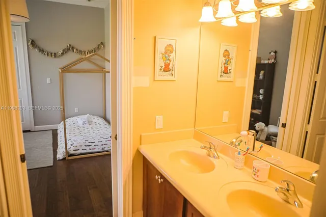a view of a dining room with furniture wooden floor and chandelier