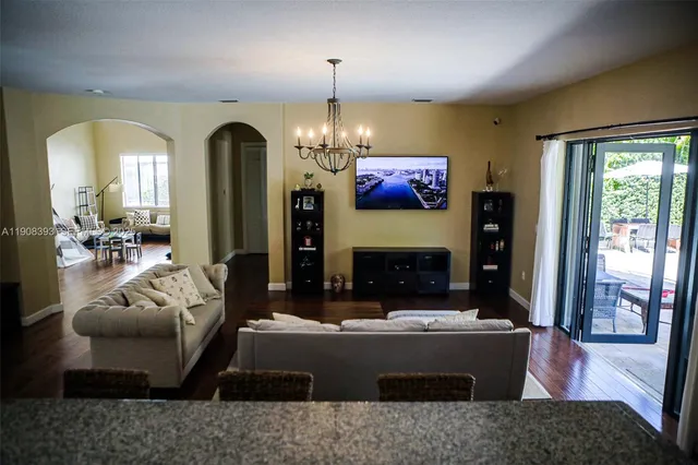 a living room with fireplace furniture and a fireplace
