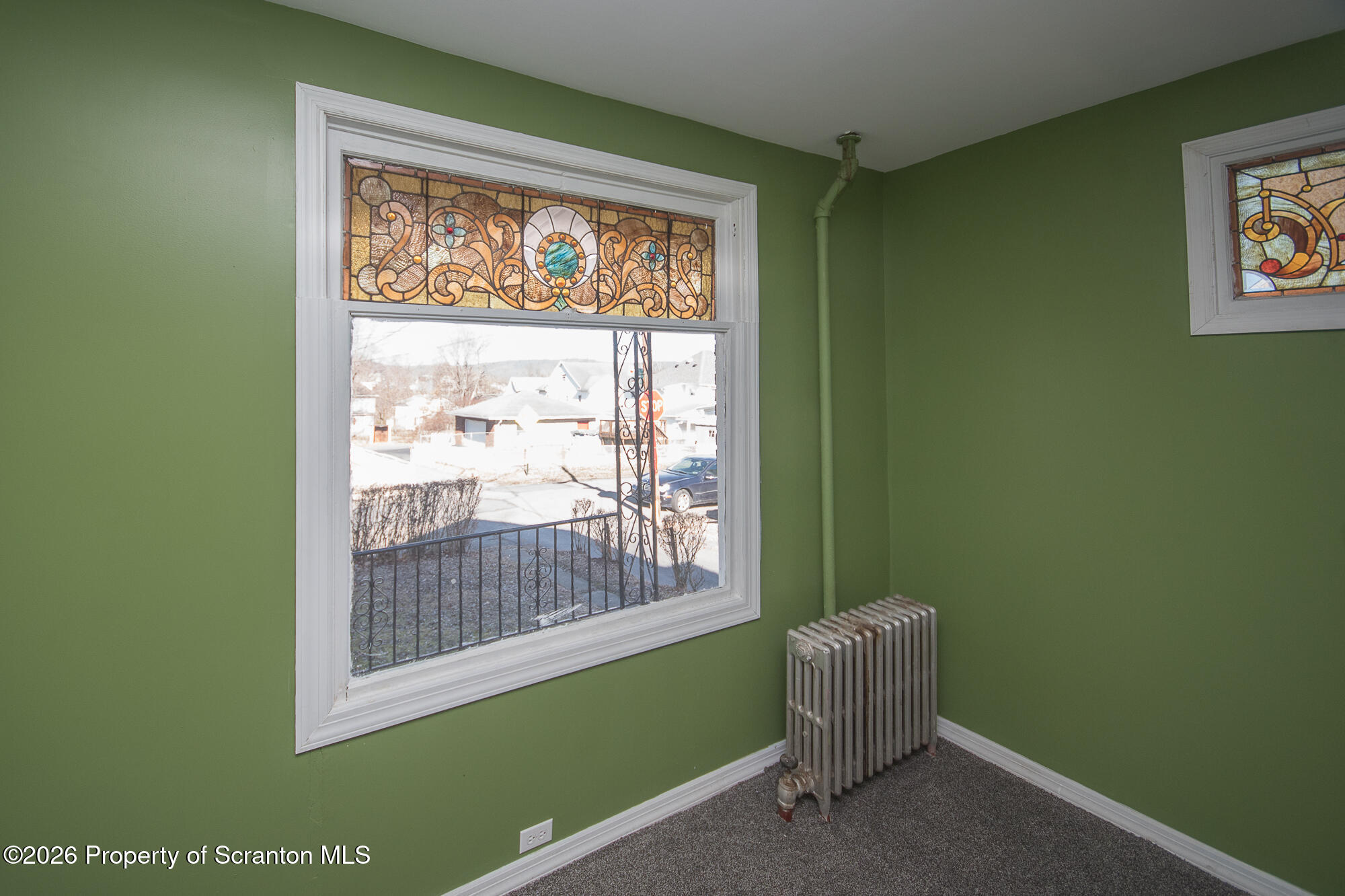 8 Stout Street Pittston, PA 18640 - Photo 12 of 25 a room with a window and a chair