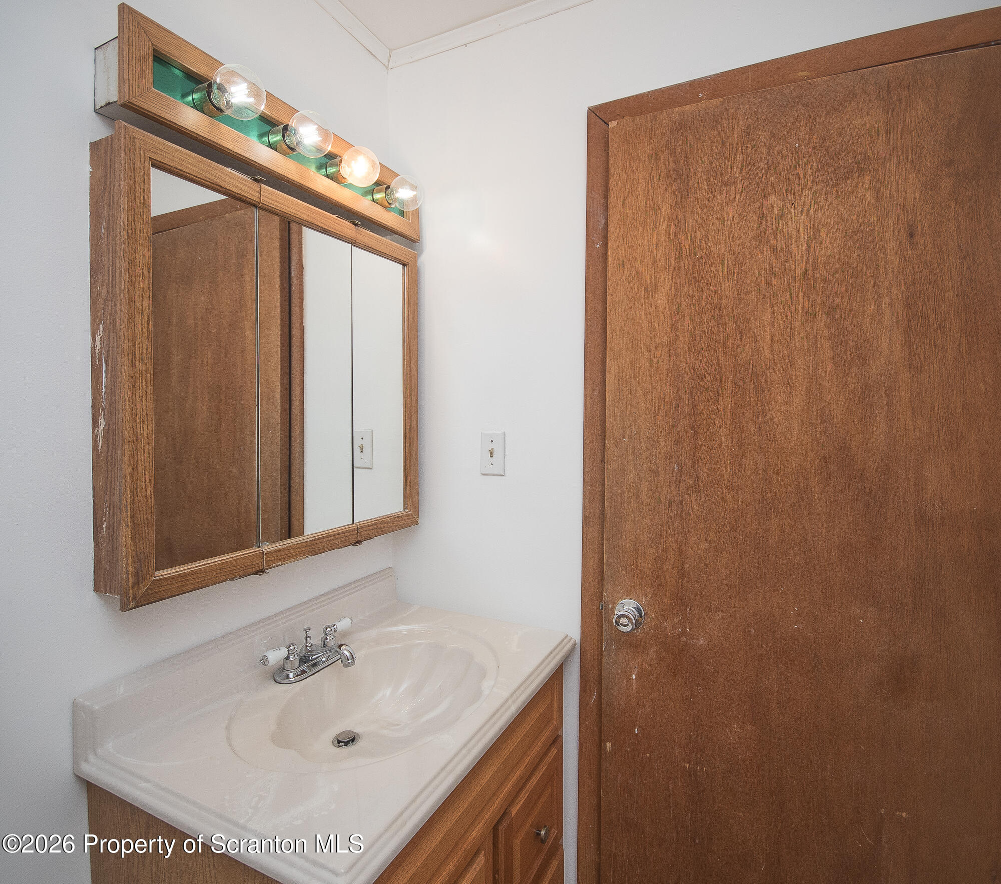 8 Stout Street Pittston, PA 18640 - Photo 15 of 25 a bathroom with a sink vanity and a mirror