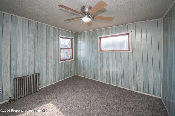 a view of an entryway with a ceiling fan