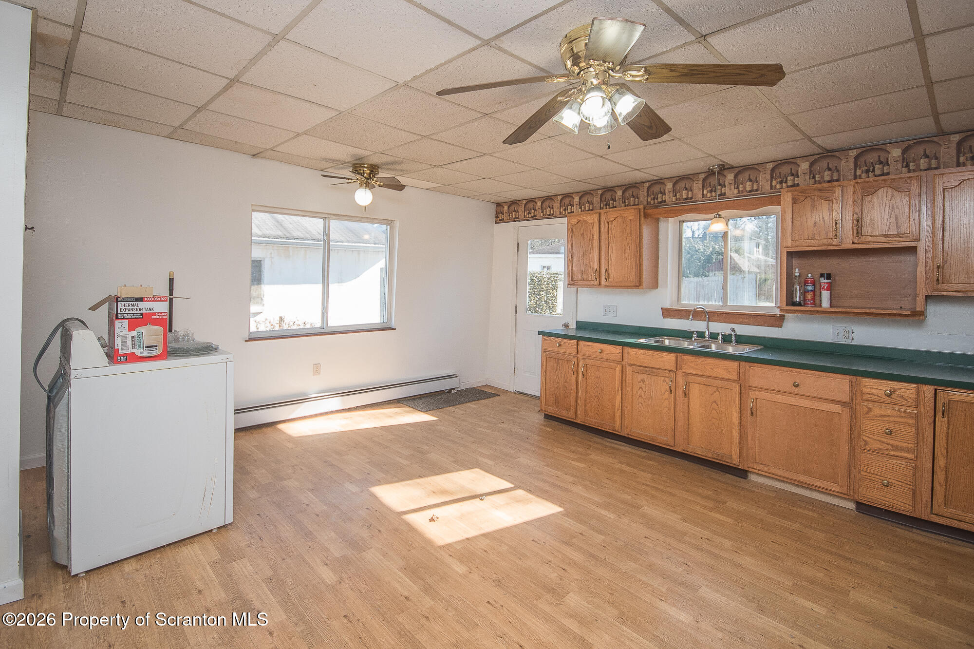 8 Stout Street Pittston, PA 18640 - Photo 3 of 25 a kitchen with granite countertop a stove a sink and a refrigerator