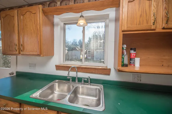 a kitchen with a sink and a window