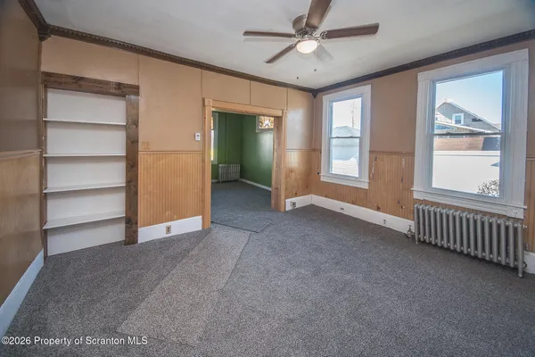 a view of an empty room with a window