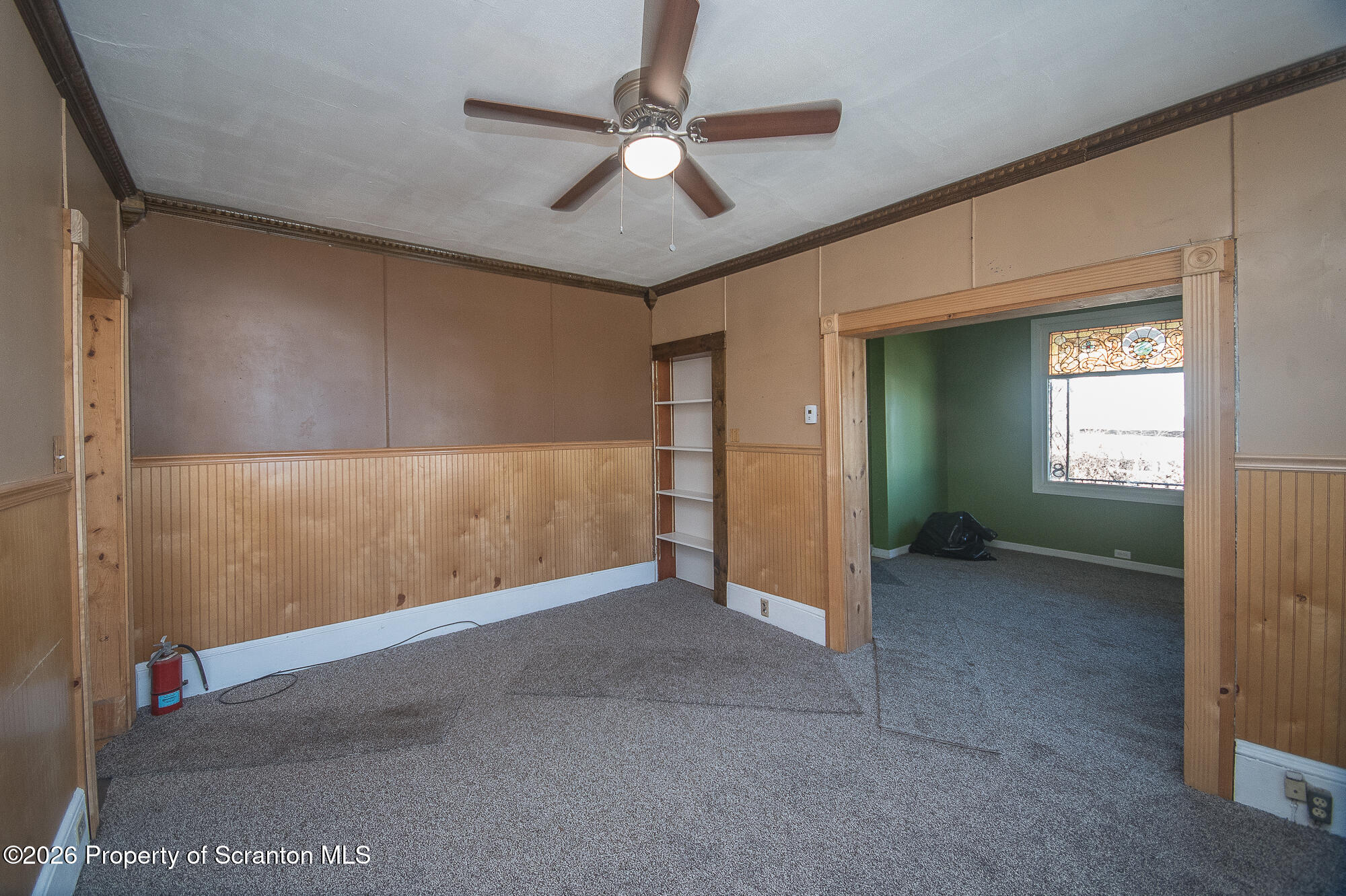 8 Stout Street Pittston, PA 18640 - Photo 9 of 25 an empty room with windows and fan