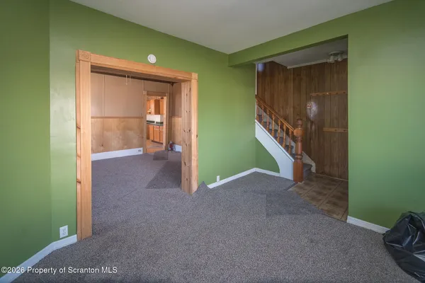 a view of an empty room with a window