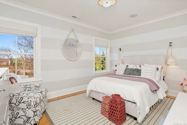 a bedroom with a bed and window