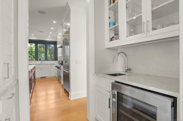 a kitchen with a sink and a refrigerator