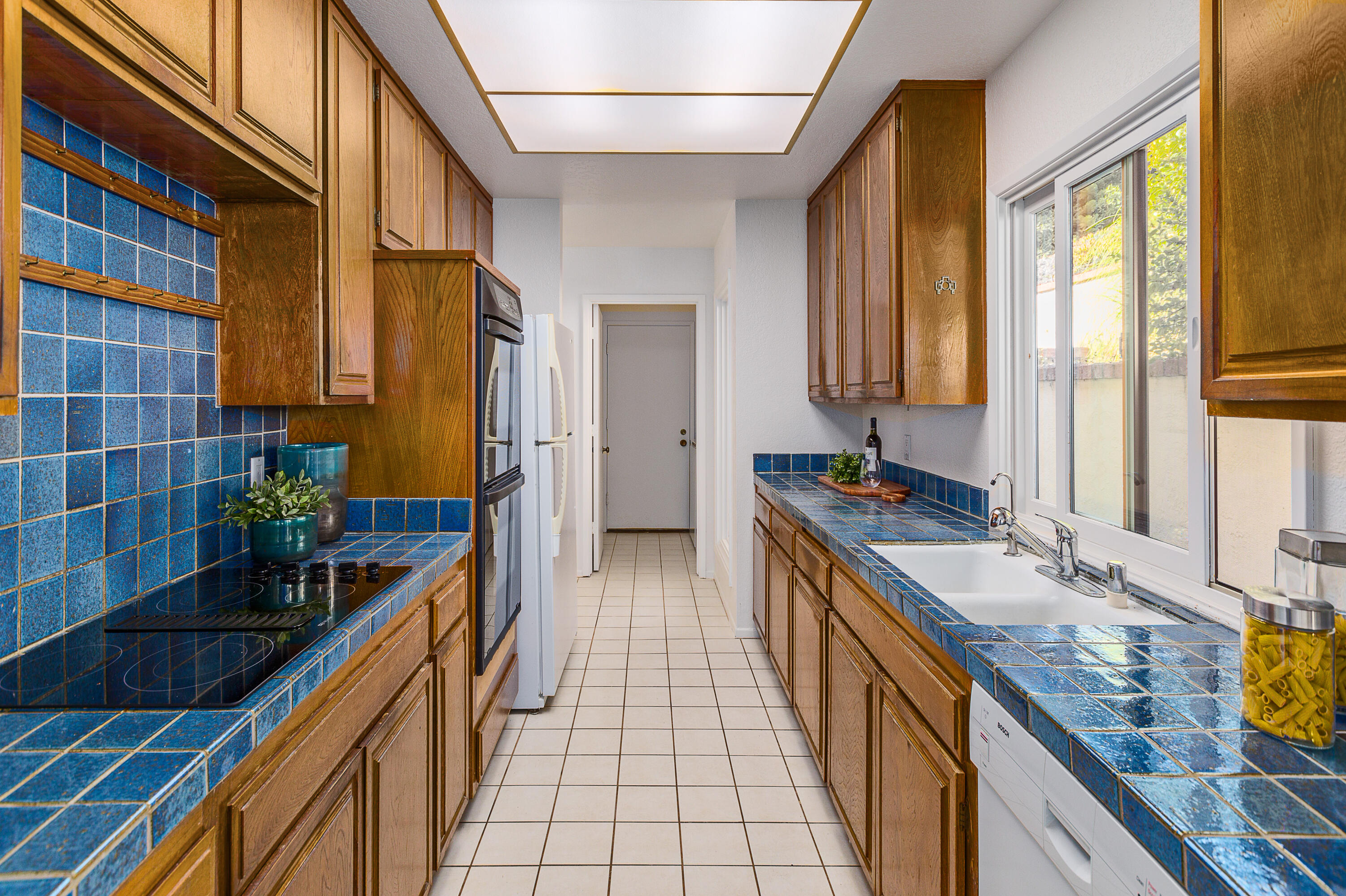 1532 Manitou Road Santa Barbara, CA 93105 - Photo 8 of 20 a bathroom with a granite countertop double vanity sink a mirror and a bathtub