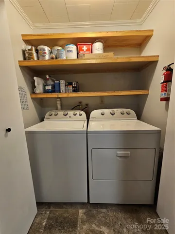 a utility room with washer and dryer