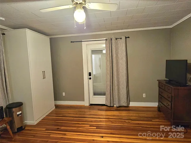 a view of a livingroom with wooden floor