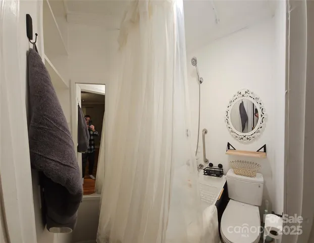 a bathroom with a toilet and a sink