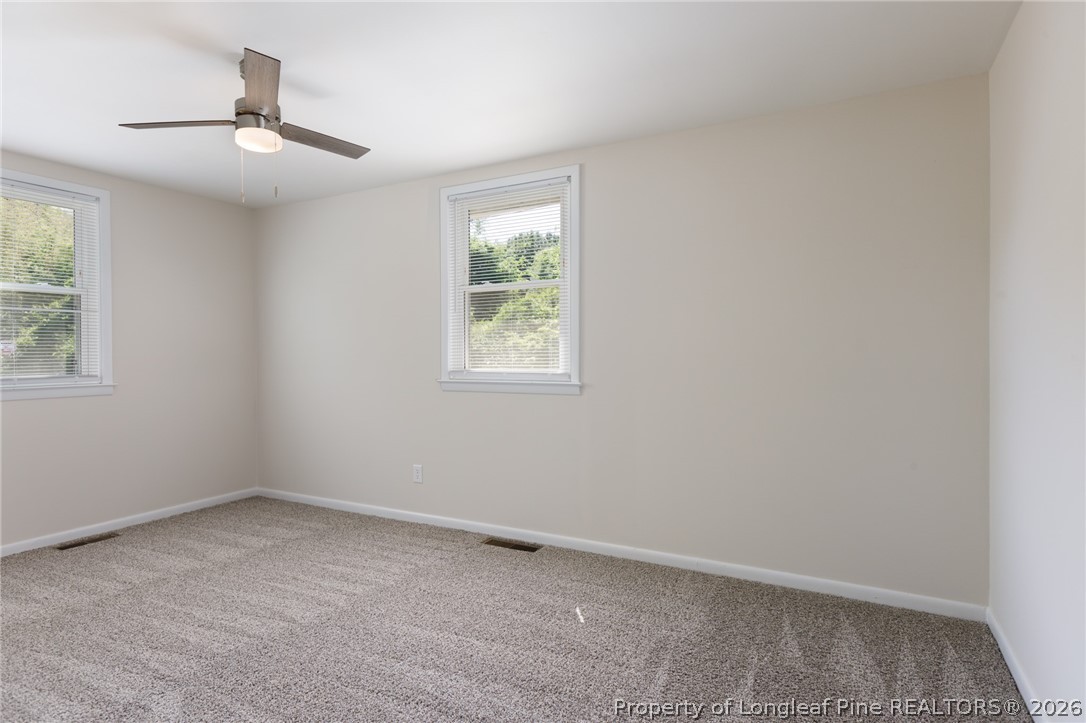 201 Scarborough Street Spring Lake, NC 28390 - Photo 11 of 26 an empty room with a window