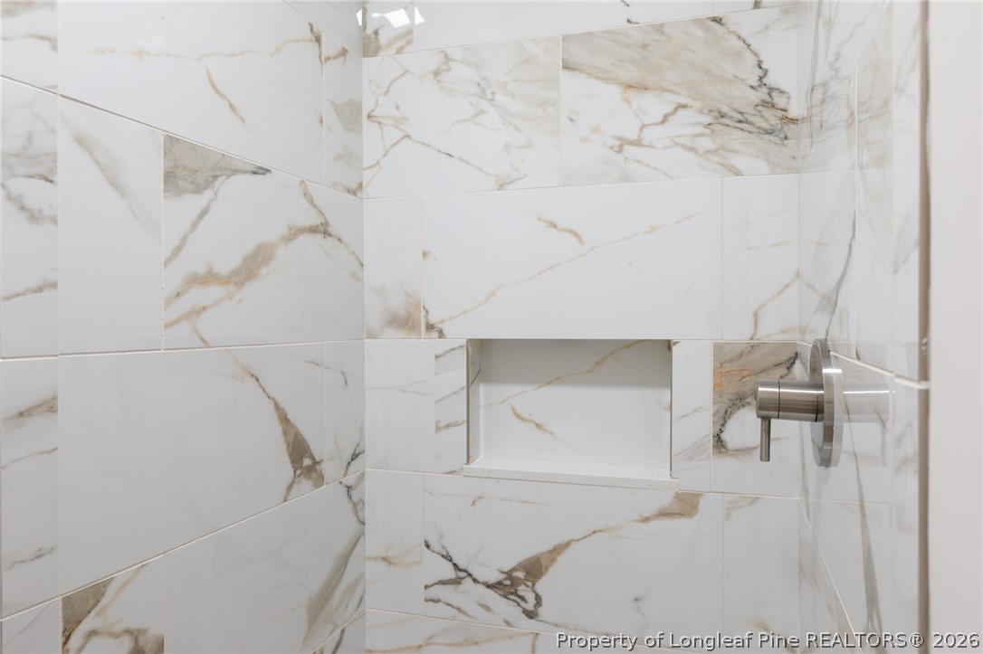 201 Scarborough Street Spring Lake, NC 28390 - Photo 20 of 26 a bathroom with a bathtub and shower