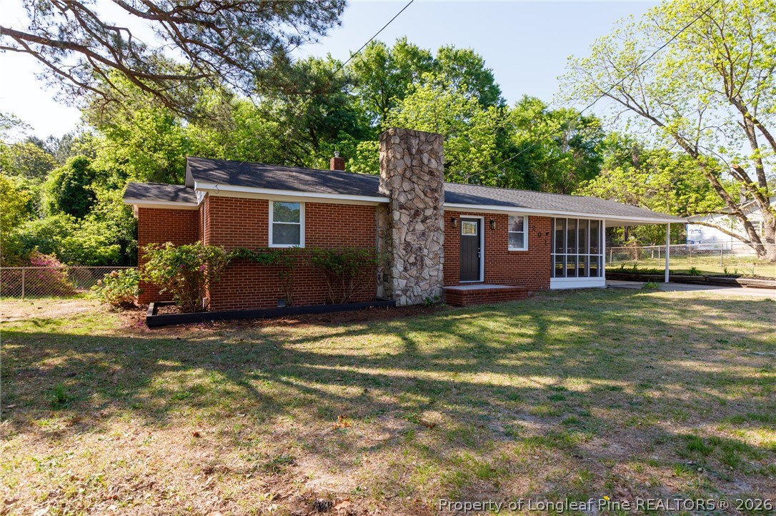 201 Scarborough Street Spring Lake, NC 28390 - Photo 2 of 26 a view of a house with a yard
