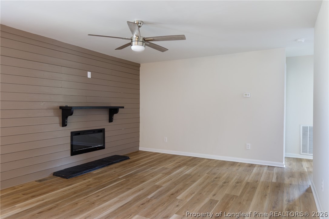 201 Scarborough Street Spring Lake, NC 28390 - Photo 5 of 26 a bedroom with a bed and a ceiling fan