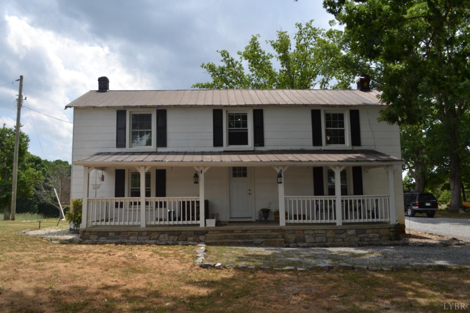 6387 Red House Road Rustburg, VA 24588 - Photo 4 of 38 a front view of a house with a garden