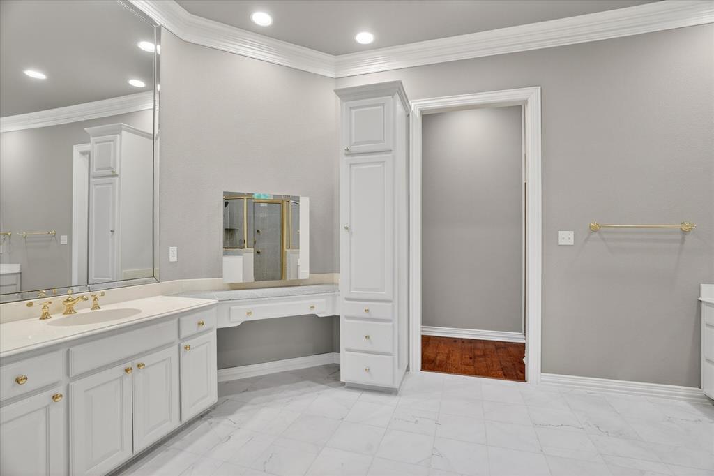 9704 Ravenswood Road Granbury, TX 76049 - Photo 19 of 40 a spacious bathroom with a mirror a shower and a sink