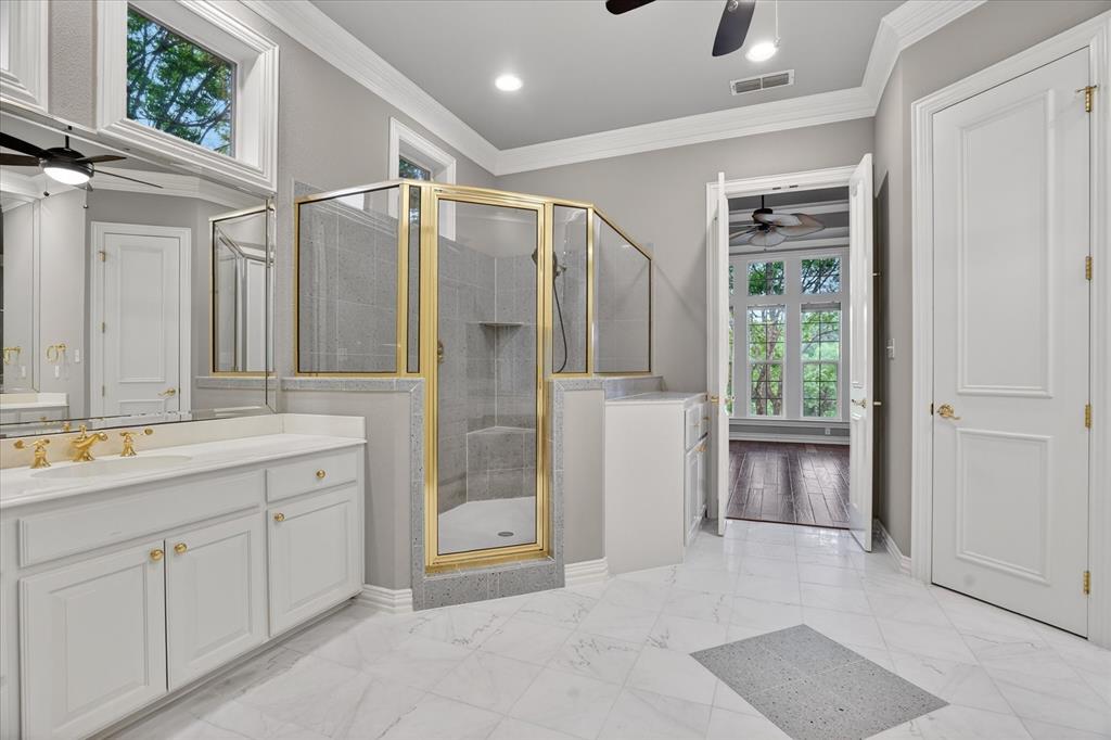 9704 Ravenswood Road Granbury, TX 76049 - Photo 20 of 40 a spacious bathroom with a shower sink and mirror