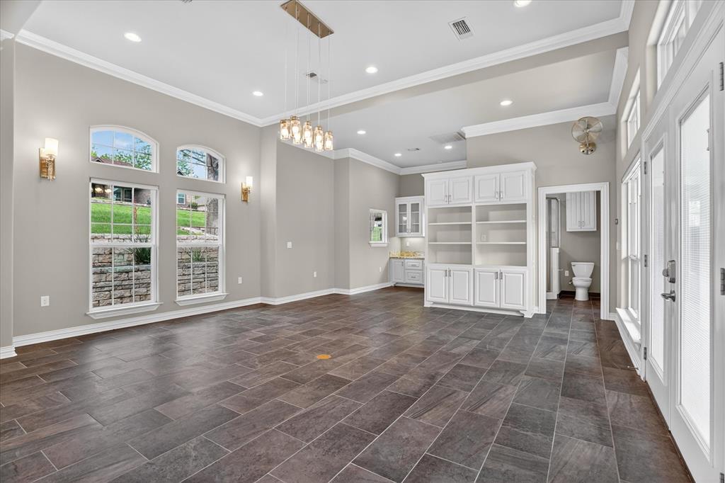 9704 Ravenswood Road Granbury, TX 76049 - Photo 31 of 40 a view of a big room with windows and entryway