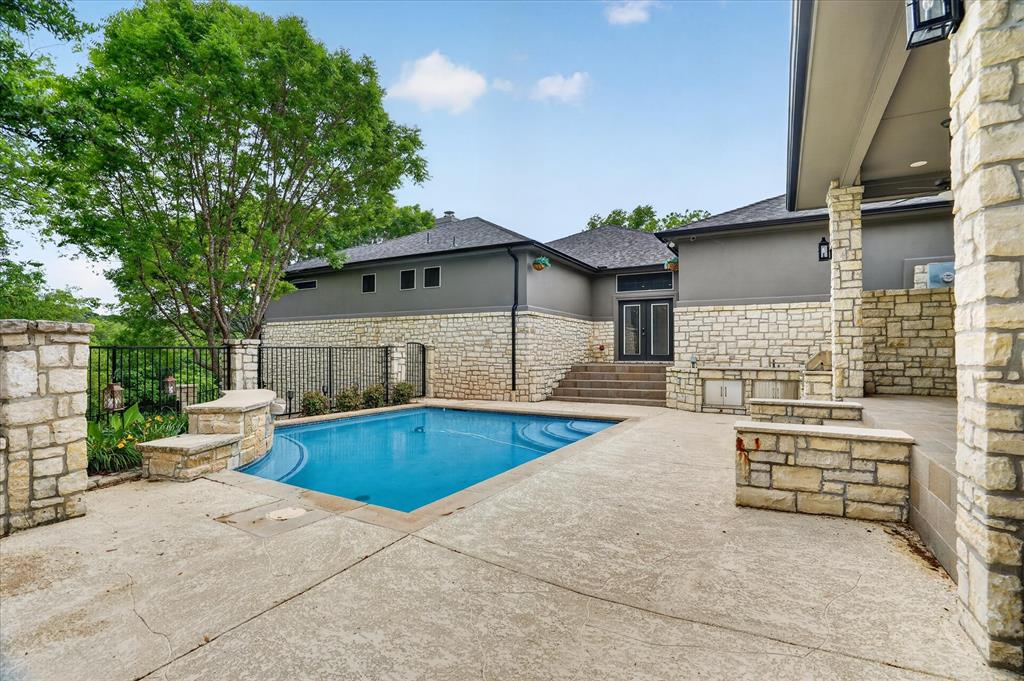 9704 Ravenswood Road Granbury, TX 76049 - Photo 34 of 40 a view of house with swimming pool outdoor seating
