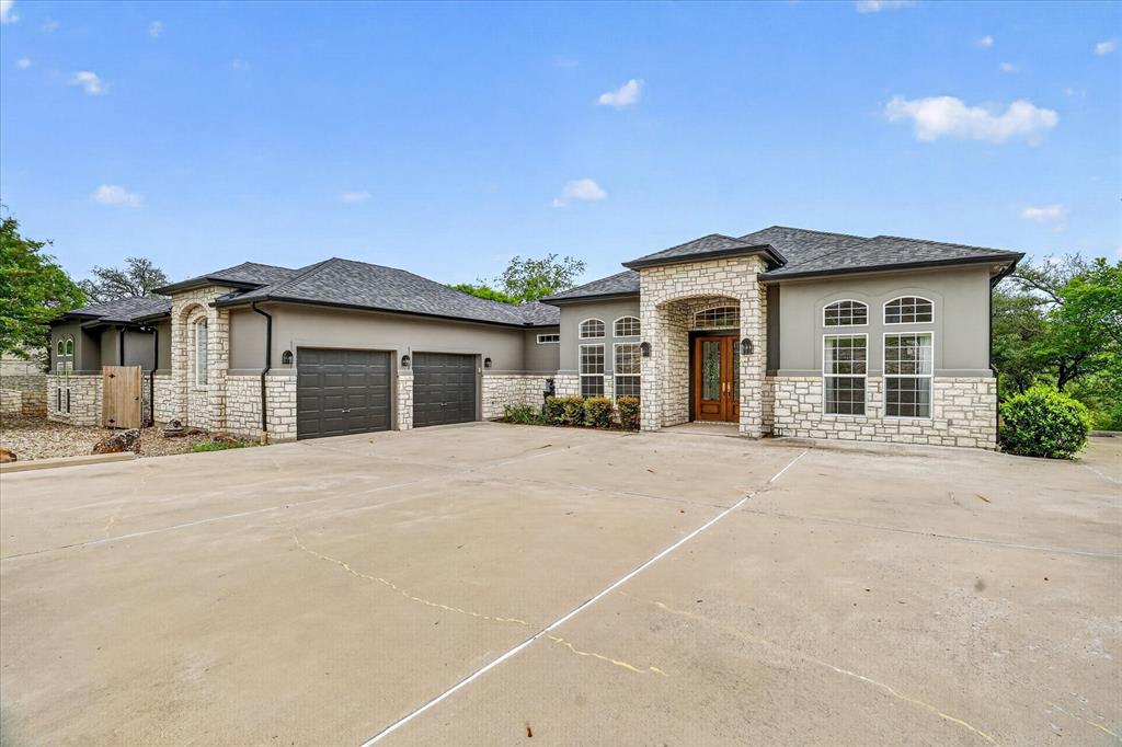 9704 Ravenswood Road Granbury, TX 76049 - Photo 7 of 40 front view of a house with a outdoor space