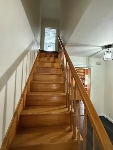 a bathroom with a granite countertop sink vanity and mirror