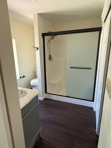 a bathroom with a bathtub sink and a mirror