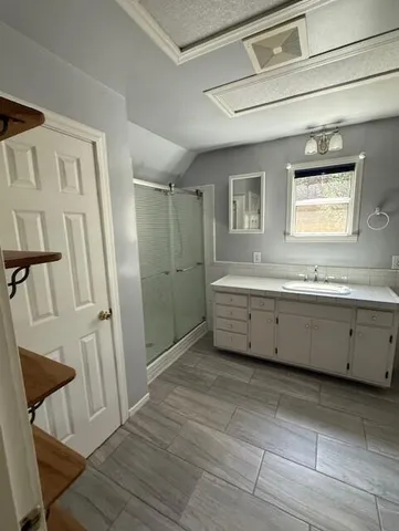 a view of a house with backyard outdoor space and garden