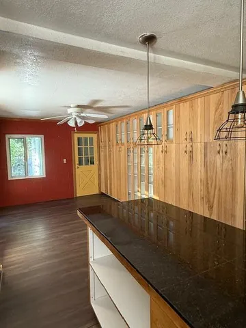 a view of wooden floor and staircase in a room