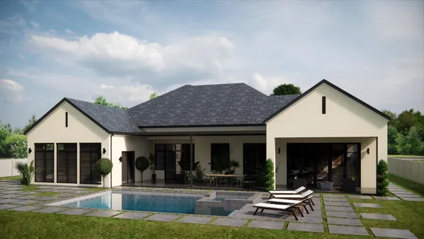 a view of a house with backyard sitting area and garden