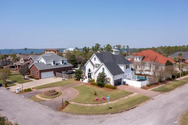 an aerial view of a house with a swimming pool