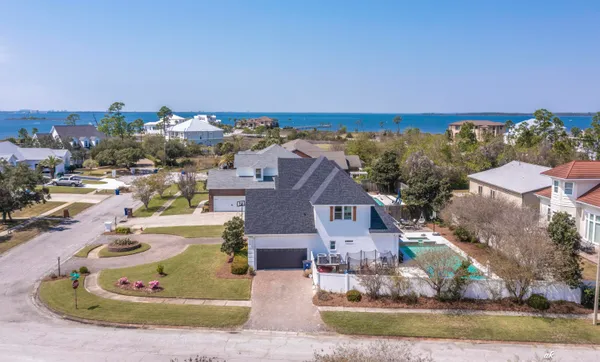 an aerial view of a house with outdoor space