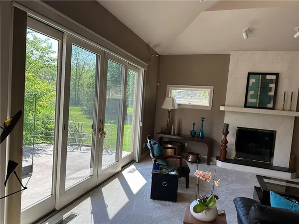a living room with furniture window and potted plant