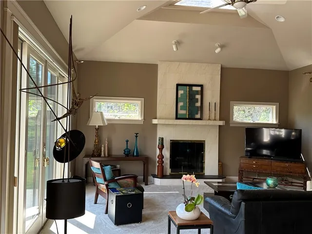 a living room with furniture and large window