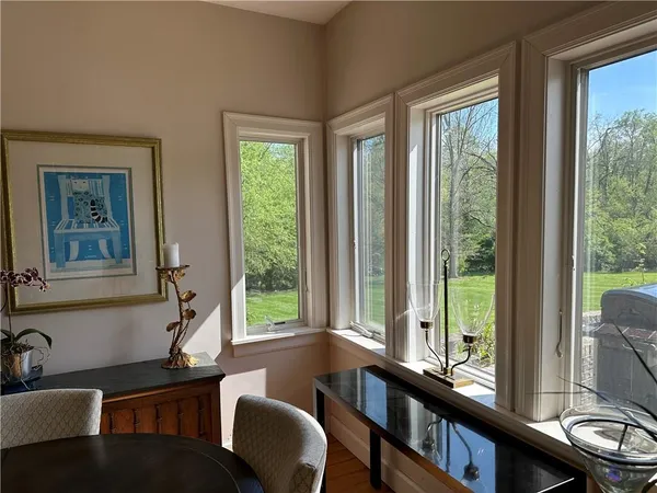 a dining room with furniture a window and outside view